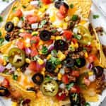 Loaded Nachos (Taco Meat, Nacho Cheese, Lettuce, Tomatoes,Jalapeno & Black Olives)