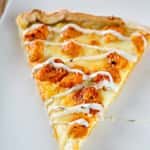 A Slice of Chicken Wing Pizza ( Hot wings & Blue Cheese base )
